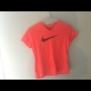 One Nike shirt and one green shirt